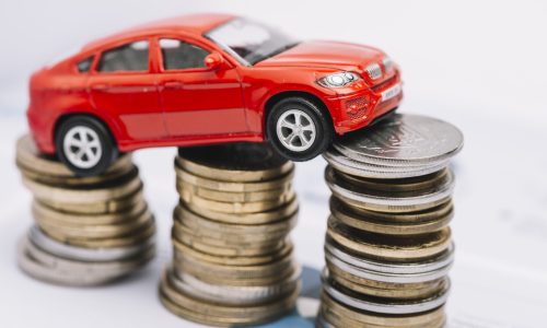 small-red-car-stack-increasing-coins